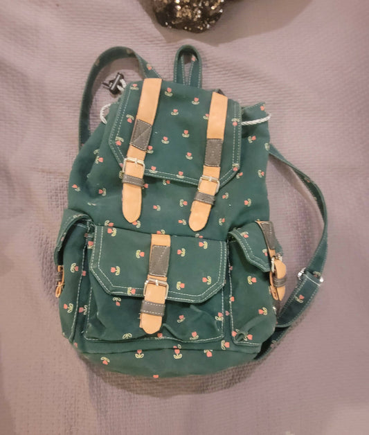 Mochila verde con flores, tela